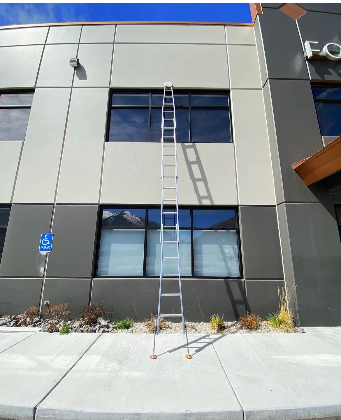 Extension-ladder commercial window setup