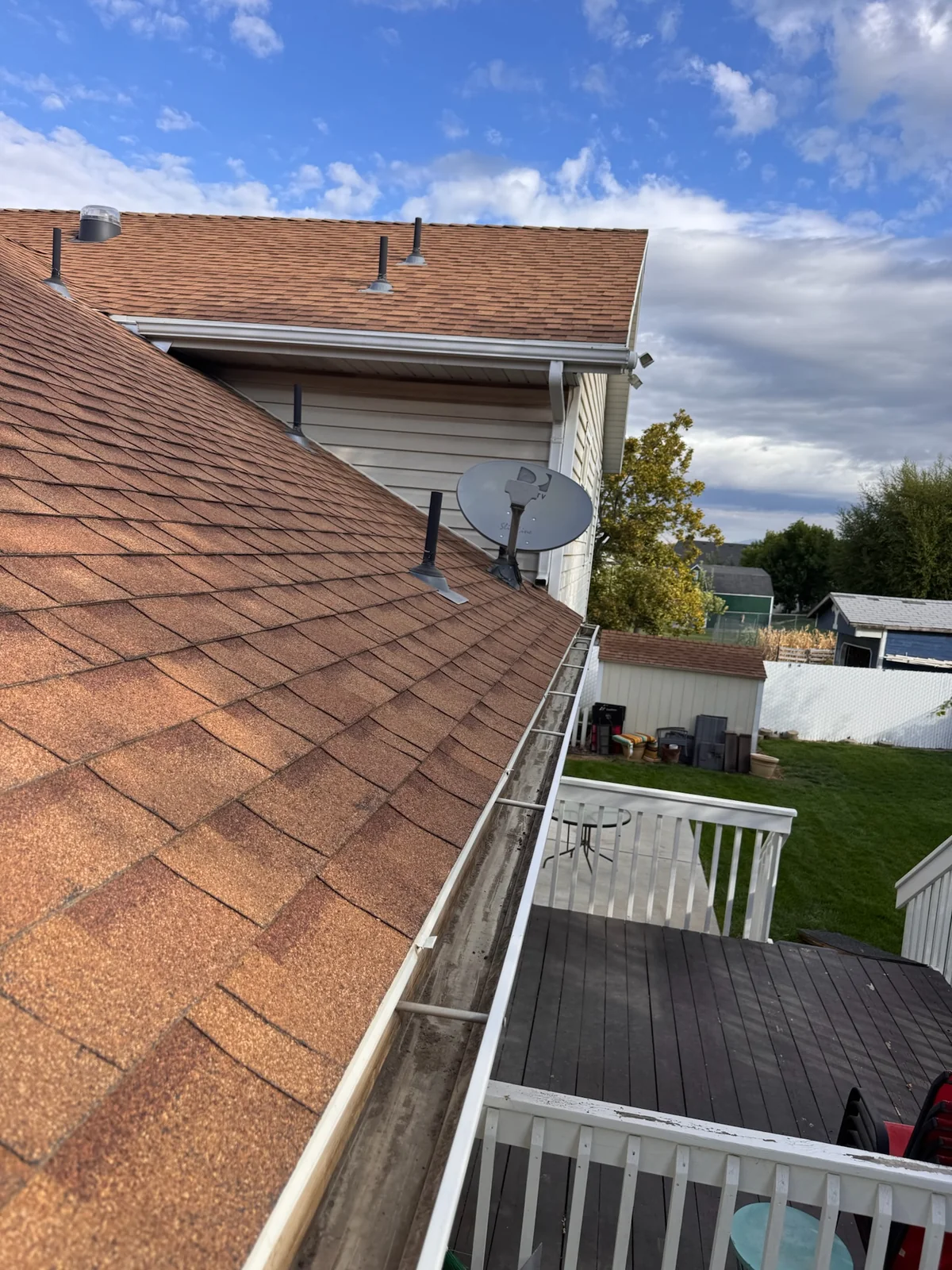 Debris visible along the roofline/gutter