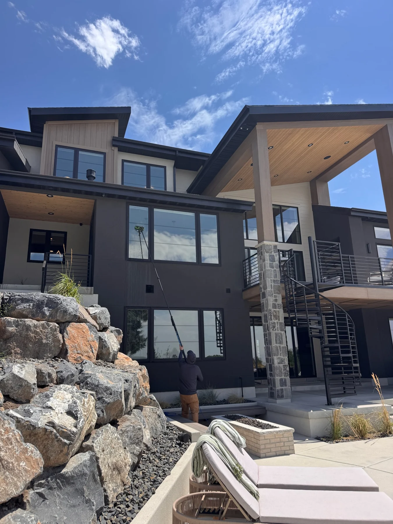 Clearly Clean water-fed pole window cleaning on a modern Northern Utah home